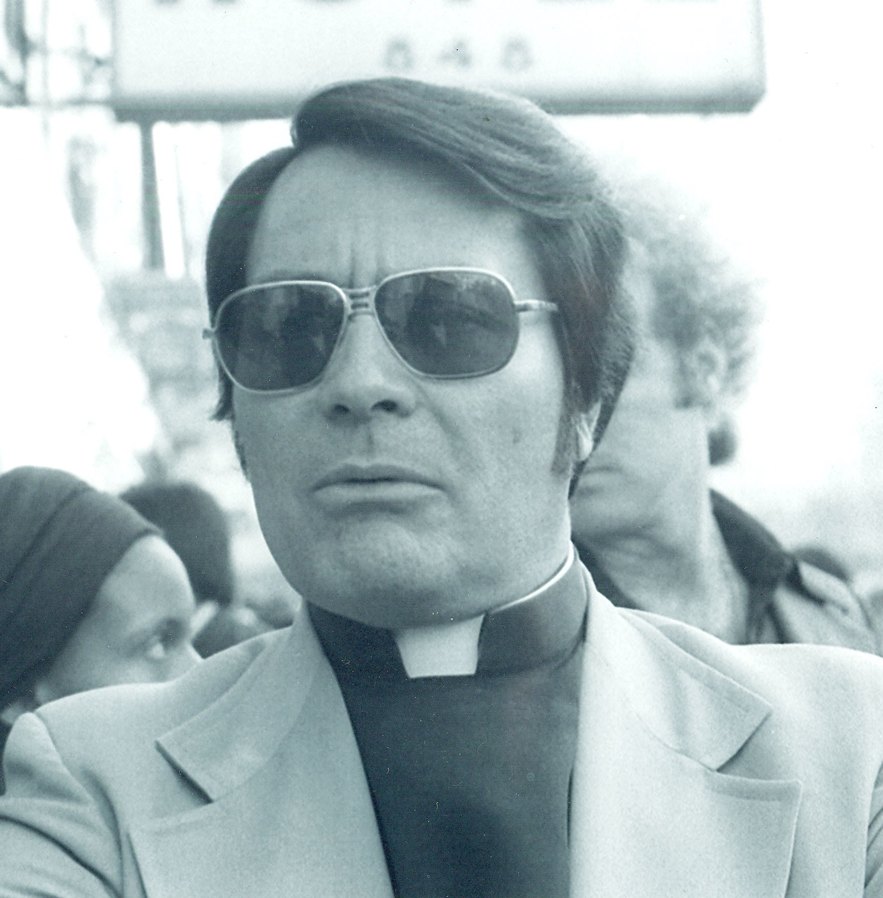 People’s Temple cult leader, Jim Jones, in sunglasses and priest’s collar.